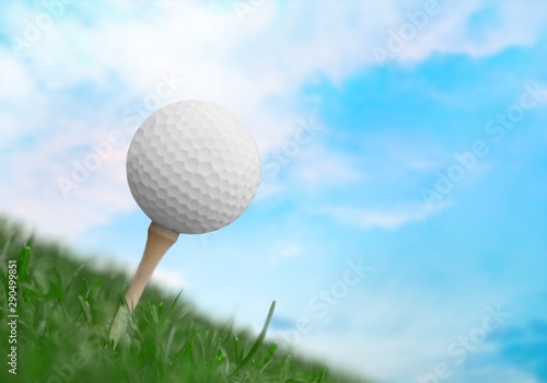 Golf ball on tee on golf course