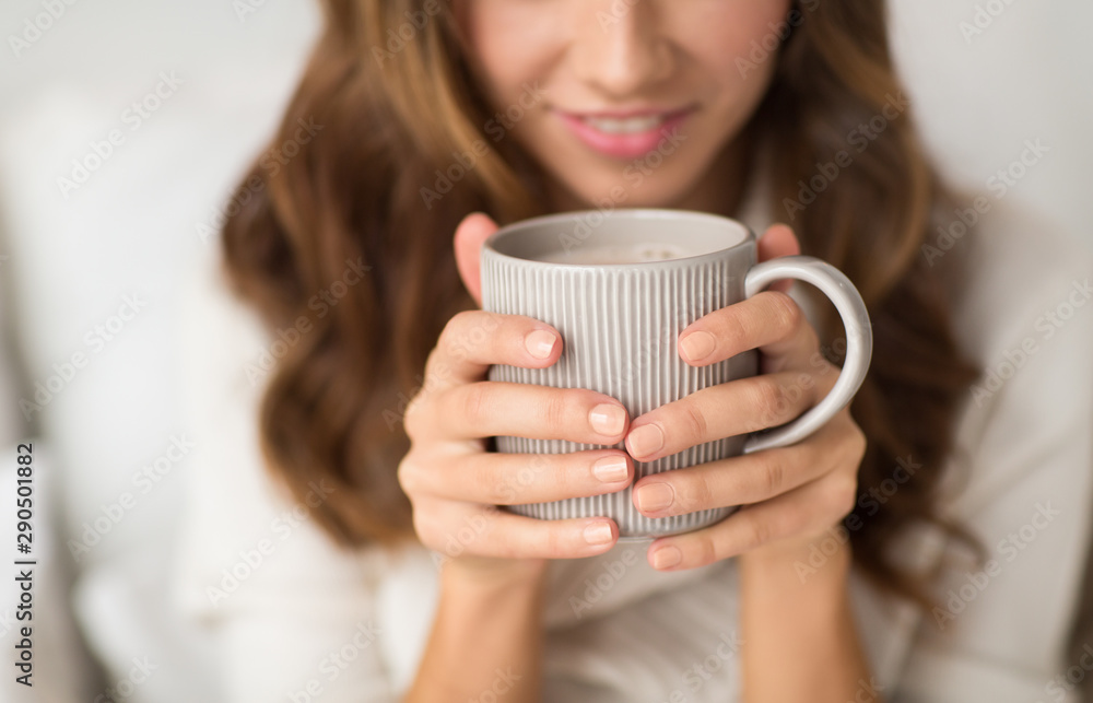 drink, christmas and hygge concept - close up of happy woman with cup of coffee at home drink, christmas and hygge concept - close up of happy woman with cup of coffee at home