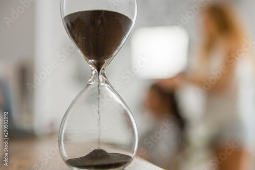 An ancient antique hourglass detects time. old clock works with sand.