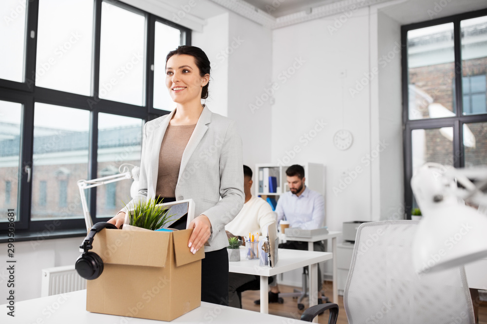business, new job and corporate concept - happy smiling businesswoman with her personal stuff at office business, new job and corporate concept - happy smiling businesswoman with her personal stuff at office