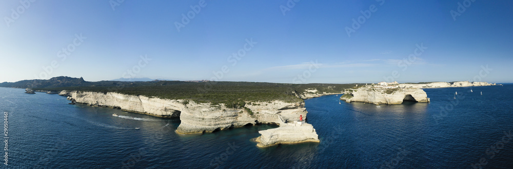 View from above, stunning panoramic view of the lighthouse of Madonnetta at the entrance to the port of Bonifacio. Bonifacio is a commune at the southern tip of the island of Corsica, France.