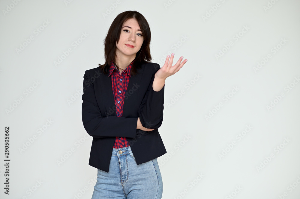 Portrait of a pretty asian brunette girl with black hair in a dark jacket and blue jeans on a white background. It stands right in front of the camera, with emotions in various poses. Portrait of a pretty asian brunette girl with black hair in a dark jacket and blue jeans on a white background. It stands right in front of the camera, with emotions in various poses.