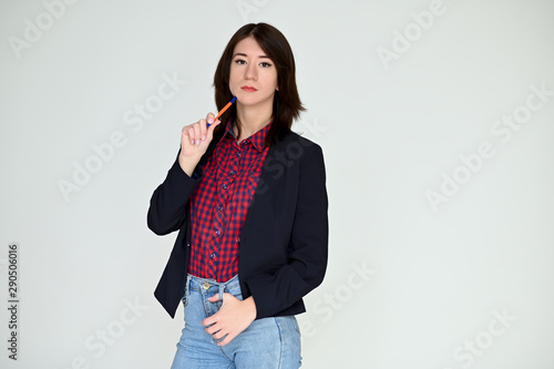 Wallpaper Mural Portrait of a pretty asian brunette girl with black hair in a dark jacket and blue jeans on a white background. It stands right in front of the camera, with emotions in various poses. Torontodigital.ca