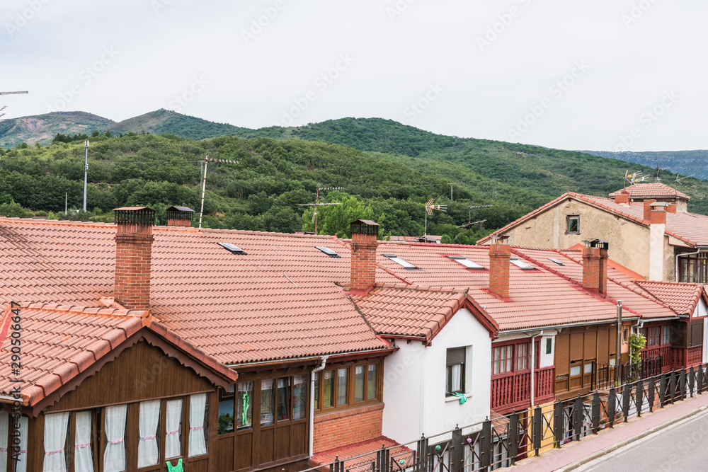 row of wooden village houses with mountain village
