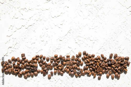 Coffee beans horizontal line on white background. Copyspace.
