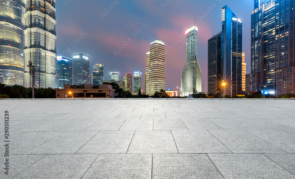Shanghai commercial center building scenery and empty square floor at night,China.