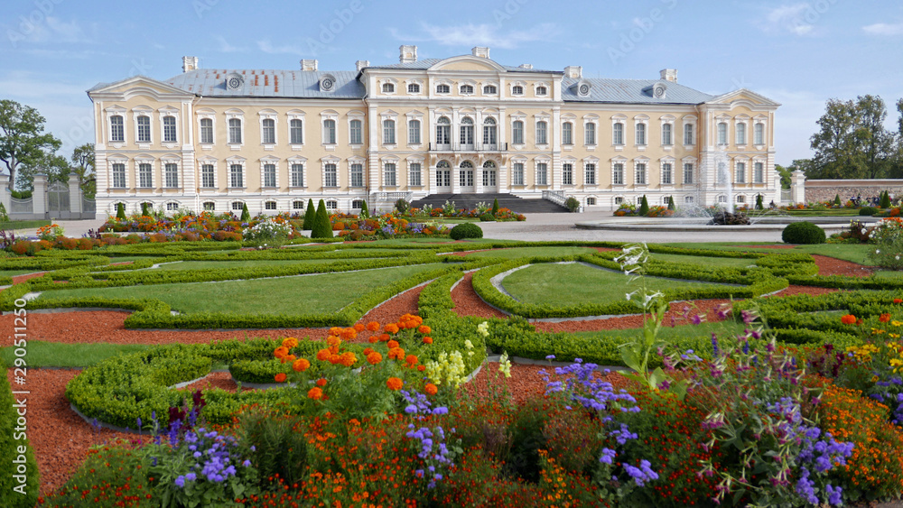 Rundale, Latvia - September 10, 2019: View on the front of the Rundale Palace. It is the most important baroque palace in Latvia. The French gardens and a large park are fenced.