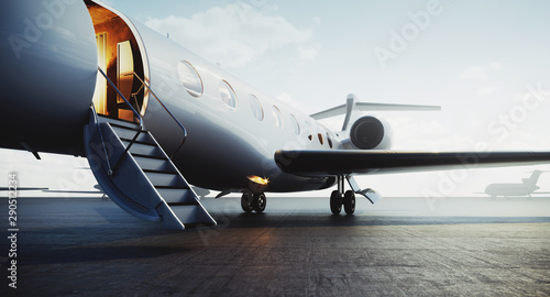 Fotografie, Obraz Closeup view of private jet airplane parked at outside and waiting business persons