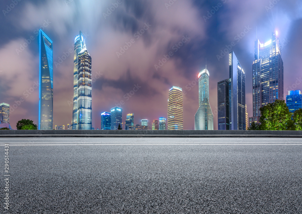 Obraz premium Shanghai modern commercial buildings and asphalt highway at night,China.