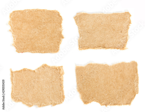 Set of small torn pieces of cardboard paper on white background. Can be used for text. photo