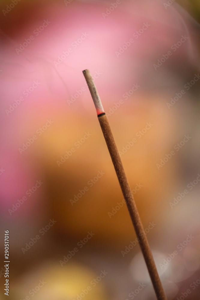 Incense Stick. Burning aromatic incense stick with smoke for praying or worshiping Buddha or Hindu gods with copy space. Incense Stick. Burning aromatic incense stick with smoke for praying or worshiping Buddha or Hindu gods with copy space.