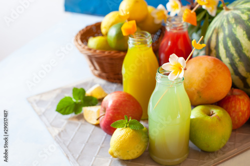 Fototapeta Naklejka Na Ścianę i Meble -  Fresh fruit, berry and vegetable juices on bright blue background.Homemade refreshing beverage