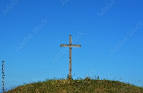 a cross on a hilltop