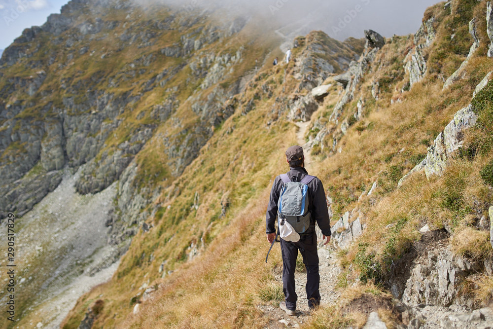 Man with backpack hiking Man with backpack hiking