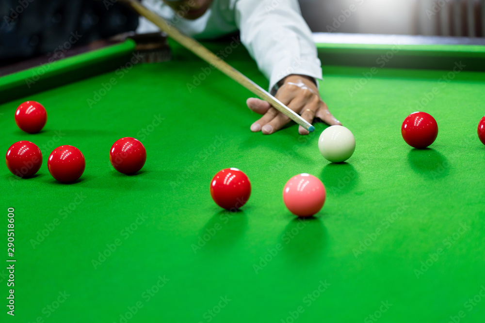 Game snooker billiards or opening frame player ready for the ball shot,  athlete man kick cue on the green table in bar. Stock Photo | Adobe Stock