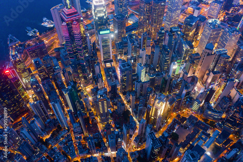 Aerial top view of Hong Kong Downtown, Republic of China. Financial district and business centers in technology smart city in Asia. Top view of skyscraper and high-rise modern buildings at night.