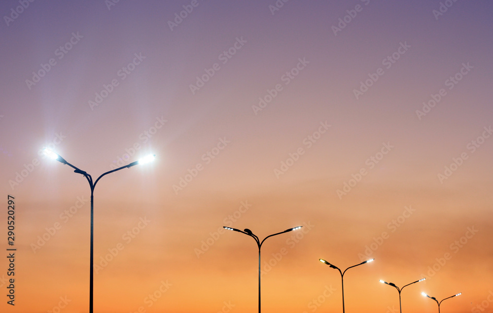 Urban landscape with modern minimal street lights and vibrant sky Urban landscape with modern minimal street lights and vibrant sky