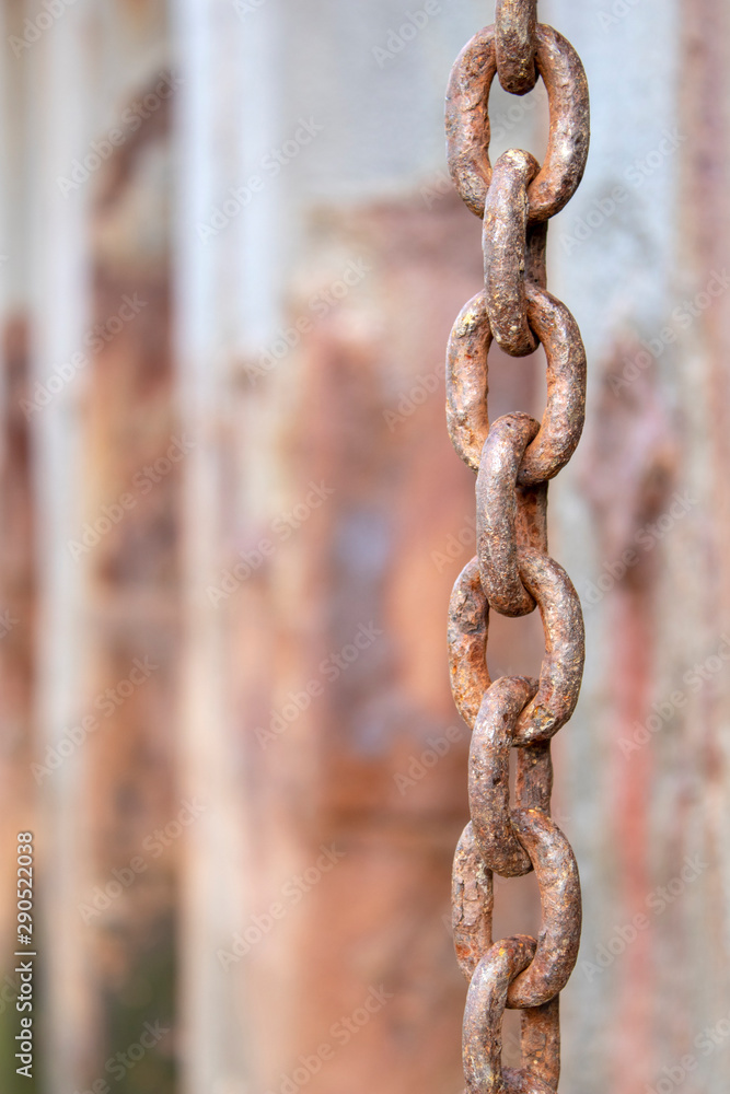 Rusty chain hanging from the wharf at Old Leigh, Leigh-on-Sea, Essex, England Rusty chain hanging from the wharf at Old Leigh, Leigh-on-Sea, Essex, England