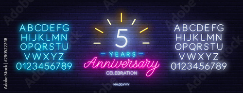 5th anniversary celebration neon sign on dark background. Neon alphabet . Template for invitation or greeting card.
