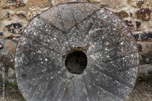 old stone wheels, with which flour is milled