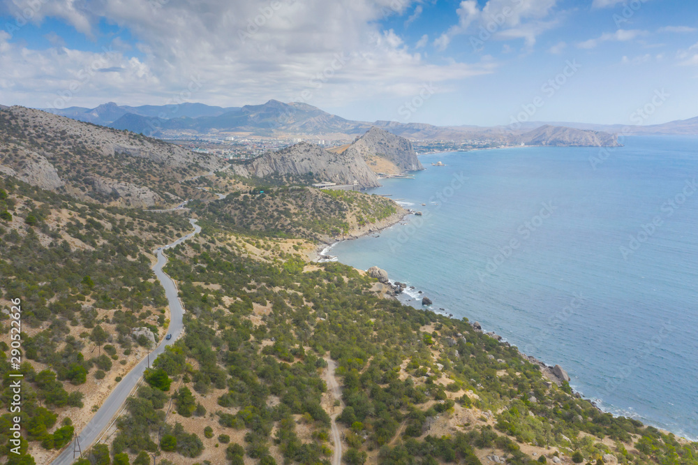 Aerial view of serpentine road in green mountains and sea, Black Sea, Novyi Svit, Crimea