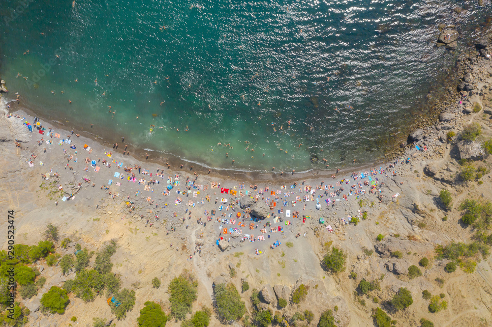 Aerial view of crowded colorful paradise beach on Black Sea, Crimea