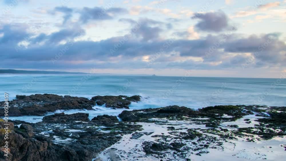 Colors of sunset sky over New Zealand ocean coast beach in wilderness nature of north island Time lapse Colors of sunset sky over New Zealand ocean coast beach in wilderness nature of north island Time lapse