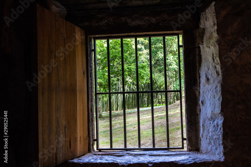 old windows in a rural house with bars