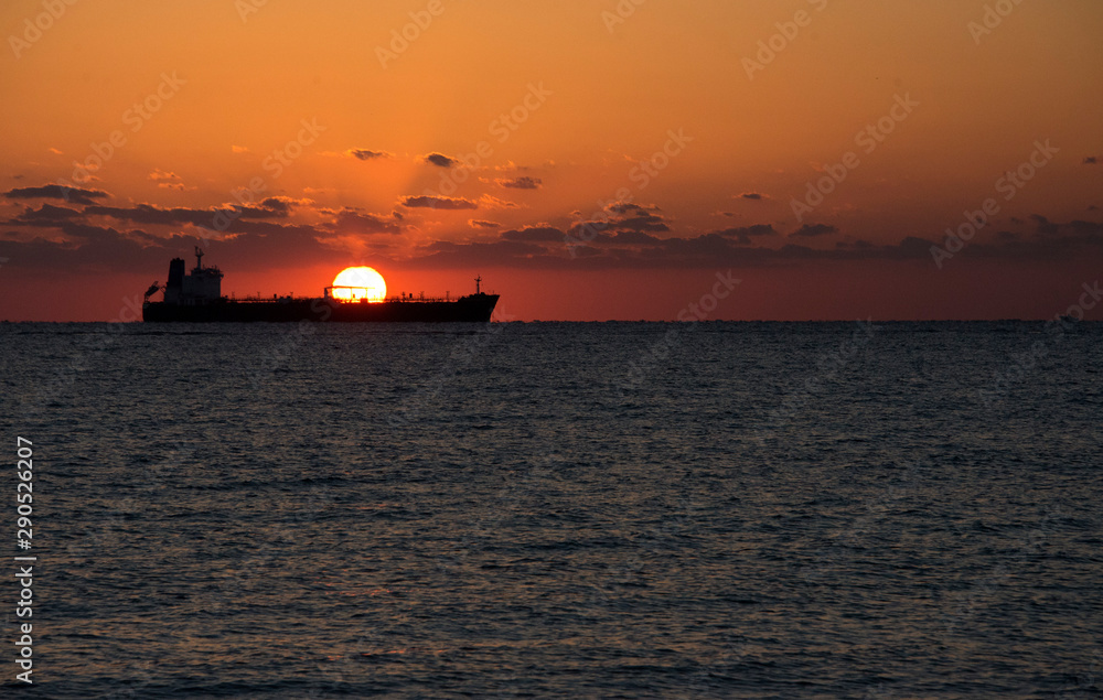 Sunrise in Fort Lauderdale, Florida with sun appearing from behind a ship