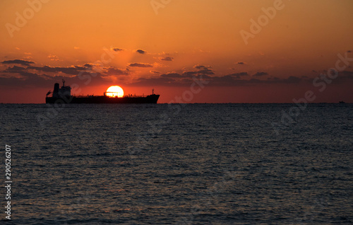 Sunrise in Fort Lauderdale, Florida with sun appearing from behind a ship © Khaleel