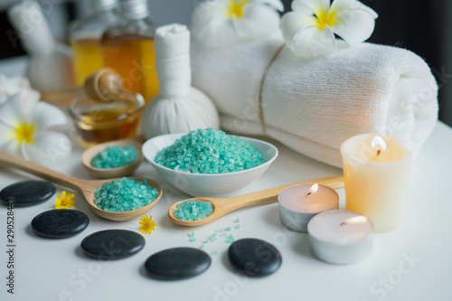 Thai spa massage compress balls and salt spa objects on table background  wellness and relaxation concept