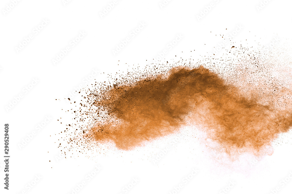 Abstract brown powder explosion. Closeup of brown dust particle splash isolated on white background Abstract brown powder explosion. Closeup of brown dust particle splash isolated on white background
