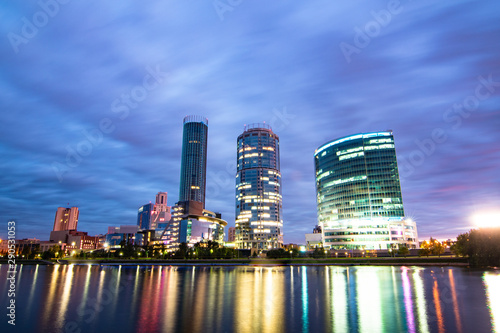 Night cityscape of Yekaterinburg  Russia with city lights reflecting in water