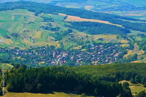 a village between the hills of Transylvania seen from above