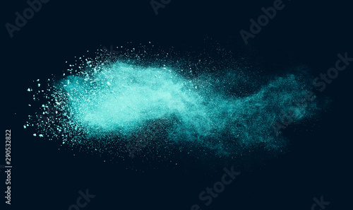 Explosion of aqua color powder on black background. 