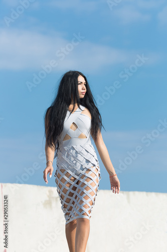 Girl promenades on seafront