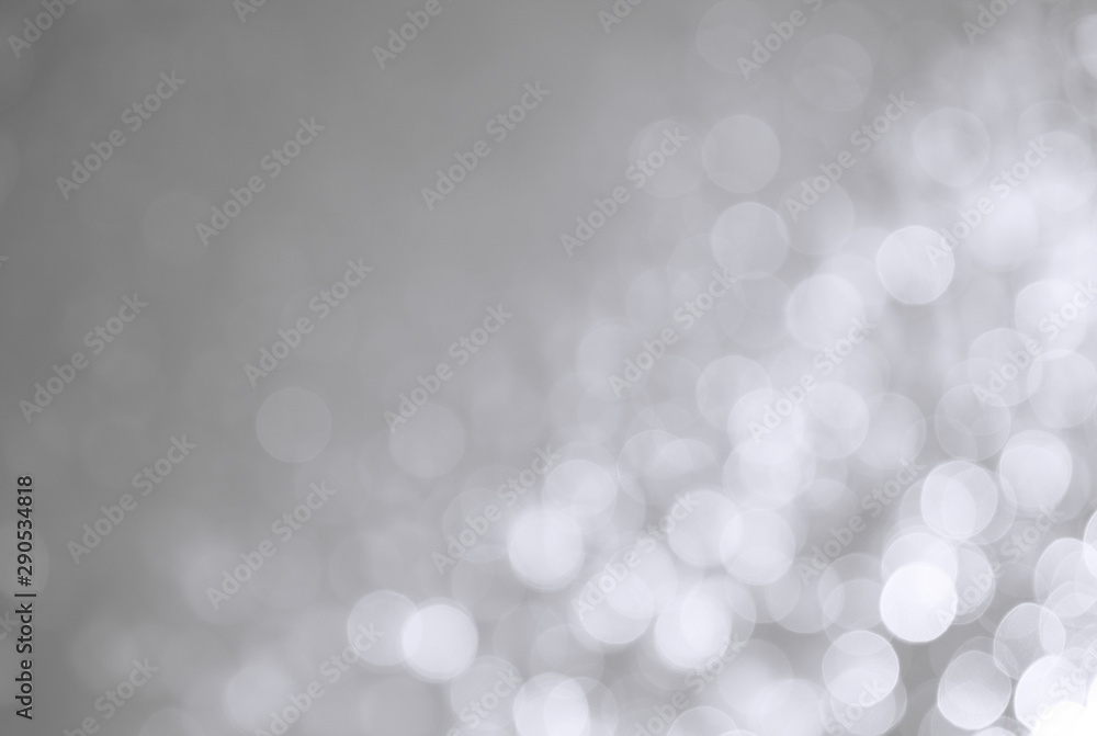 Abstract defocused glittering background. Blurry bokeh. Festive and holiday concept