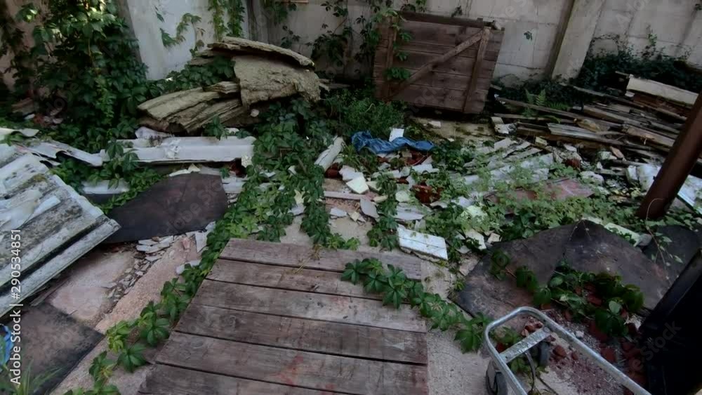 4K Backwards moving tilt up abandoned garbage filled dumping backyard 4K Backwards moving tilt up abandoned garbage filled dumping backyard