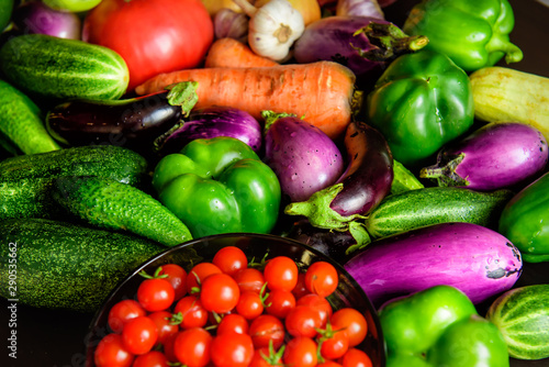 A pile of various vegetables on the table  water drops on fresh vegetables. Harvest from the garden. Vitamins  longevity foods  organic meal.