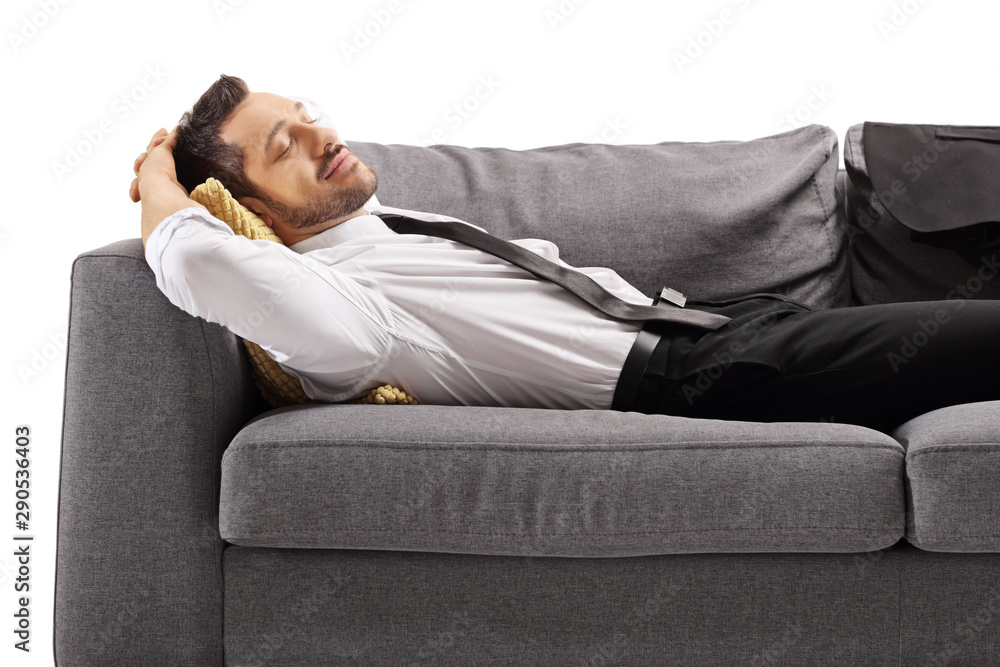 Young professional man in shirt and tie sleeping on sofa