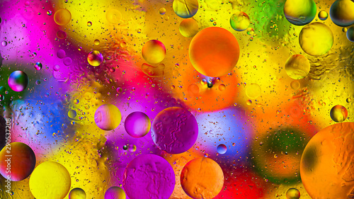 Colorful artistic image of oil drop on water for modern and creation design background.