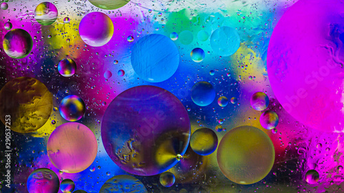 Colorful artistic image of oil drop on water for modern and creation design background.