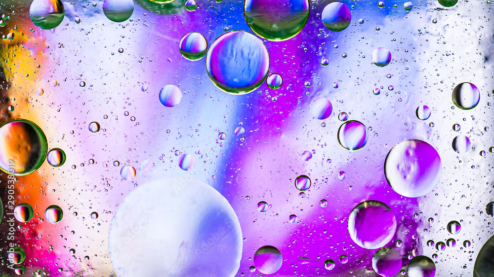 Colorful artistic image of oil drop on water for modern and creation design background.