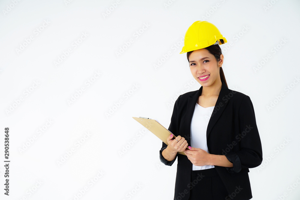 Portrait young engineer women wearing a black suit and Yellow Safety helmet With clipboard and document in hand Construction and architectural industry a copy space isolated on white background studio Portrait young engineer women wearing a black suit and Yellow Safety helmet With clipboard and document in hand Construction and architectural industry a copy space isolated on white background studio