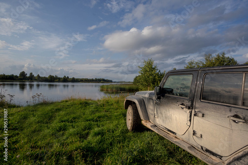 black SUV on the river Bank