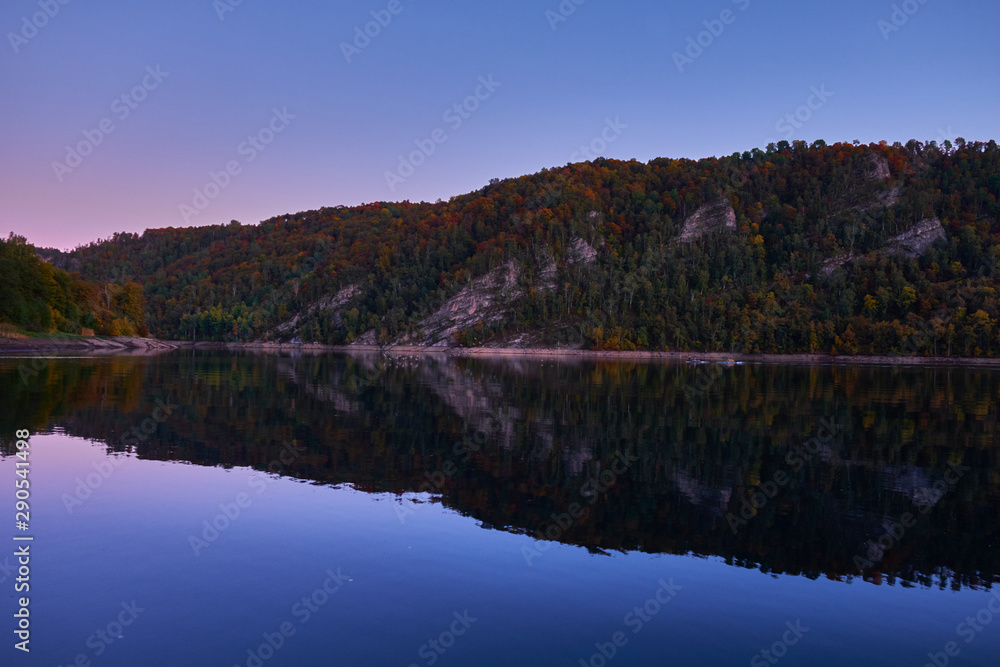 Autumn lake in Kamchatka among the mountains and forests. the nature of Kamchatka