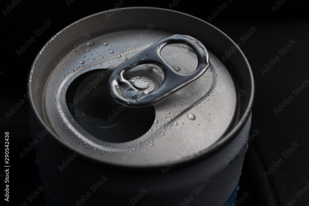 open aluminum can with water drops in dark background open aluminum can with water drops in dark background