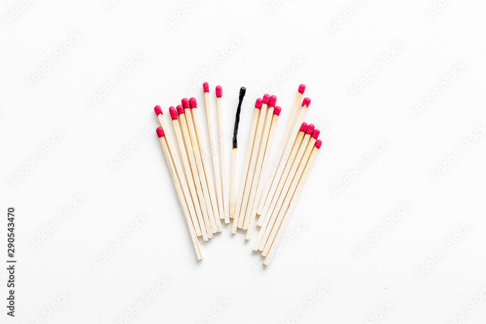 Symbol of danger with matches on white background top view Symbol of danger with matches on white background top view