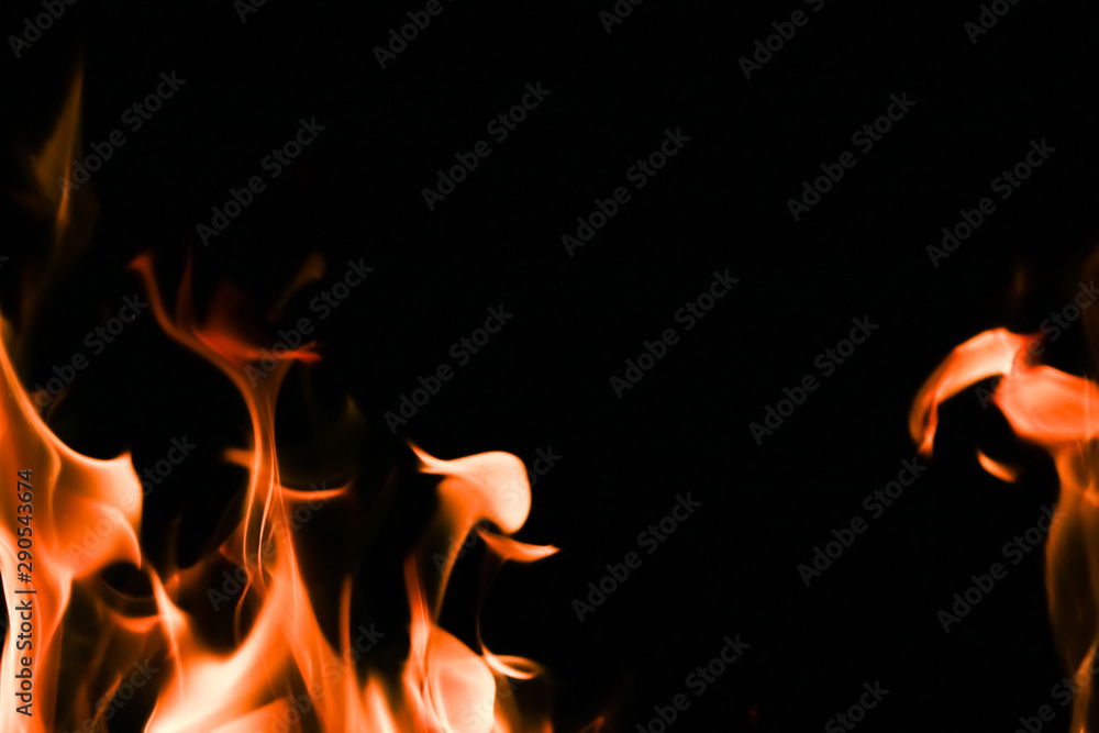Fototapeta premium Fire flames on black background