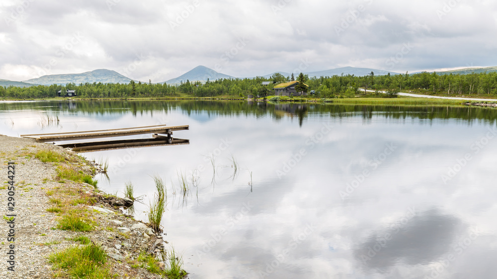 Panorama of Ringebu Kommune with view on a lake and the moutains of Rondane national Park in Oppland Norway